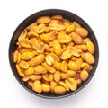 Close up of Heeng jeera Peanuts mixture Indian namkeen snacks on a ceramic black bowl. Royalty Free Stock Photo