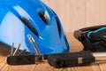 Close-up of a helmet, tools for cycling on a wooden