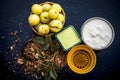 Close up of herbal face pack of Indian gooseberry or amla with curd or yogurt and honey in a glass bowl on wooden surface used to