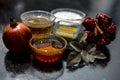 Close up of herbal and organic face pack of pomegranate with honey,green tea,curd or yogurt on wooden surface in a bowl with some