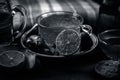 Close up of a herbal tea  consisting of apple juice,lemon,ginger and warm water in a transparent cup on a wooden surface in dark G Royalty Free Stock Photo