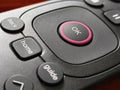 A close-up, high-angle view of a modern television or streaming device remote control. Royalty Free Stock Photo