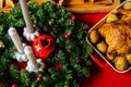 Close-up high-angle view of roasted homemade thanksgiving turkey on Christmas dinner feast table with green branches of Royalty Free Stock Photo