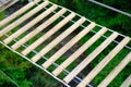 Close-up high angle view of wooden deck of a simple suspension bridge aka rope bridge, suspended bridge, hanging bridge, or catena Royalty Free Stock Photo