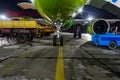 Close-up with high detail of a large wide-body passenger aircraft standing in the airport parking lot during ground handling at Royalty Free Stock Photo