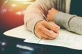 Close up , High School male student holding pencil exams writing in classroom for education test ,Copy space for your text. Royalty Free Stock Photo