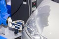 Close up high technology and accuracy equipment robot arm with laser portable 3d scan during inspection automotive part at factory