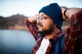 A close up of hiking man admiring the lake view while backpacking the mountains Royalty Free Stock Photo