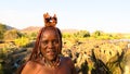 Himba lady infront of Epupa Falls - Namibia - Africa