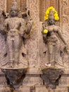 Close up of Hindu goddess with yellow flowers, Trichy, southern India