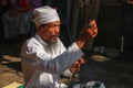 Close up of Hindu priest prays during a wedding ceremony. The pedanda performs wedding ceremonies