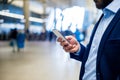 Close up of hipster businessman with smartphone, subway station Royalty Free Stock Photo