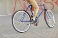 Close up of hipster man riding fixed gear bike Royalty Free Stock Photo