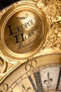 Close-up of historic gold and black clock