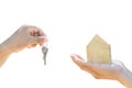 Holding house model and house key in hand.Mortgage loan approval home loan and insurance concept.on white background