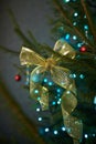 Close up of holiday electric blue garlands on fir branch with Christmas tree decoration and candy cane Royalty Free Stock Photo