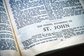 Close up of Holy Bible page, shallow depth of field with focus on book chapter, heading