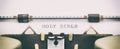 HOLY BIBLE in capital letters on a typewriter sheet