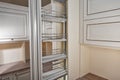 Close Up home interior. Kitchen - opened door with chrome furniture shelf. Wood and Chrome Material, Modern Design Royalty Free Stock Photo