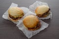 Close-up of home made burgers on wooden background