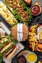 Close-up of home made tasty burger and hot dogs with fried chicken french fries. raditional American food. fast food Royalty Free Stock Photo