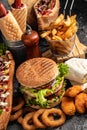 Close-up of home made tasty burger and hot dogs with fried chicken french fries. raditional American food. fast food Royalty Free Stock Photo