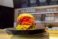 Close-up of home made tasty burgers on plate in restaurant. Royalty Free Stock Photo