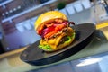 Close-up of home made tasty burgers on plate in restaurant. Royalty Free Stock Photo