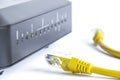 Router with led lamps and yellow ethernet cat cable Royalty Free Stock Photo