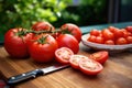 close-up of homegrown tomatoes on a table with a knife