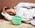 Close-up homeless man sitting on walking street in the capital city. Royalty Free Stock Photo