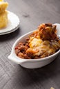 Close up of homemade baked chili in small porcelain bowl Royalty Free Stock Photo