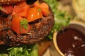 Close up of Homemade beef hamburger tomatoes on top