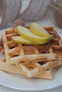 Close Up Homemade Belgium Waffles with Apples and cinnamon, honney. Close up Breakfast. homemade Food. Vertical Image.