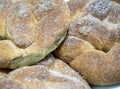 Close-up of homemade bread bun with shiny crystals of sugar on top