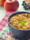 Close up of homemade cake portion served in a mug. Fresh crumble cake with apples.