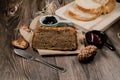 Close up Homemade delicious freshly baked classic sweet banana bread sliced with blueberry/strawberry jam and butter knife on a wo Royalty Free Stock Photo