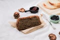 Close up Homemade delicious freshly baked classic sweet banana bread sliced with blueberry/strawberry jam and butter knife on a wh Royalty Free Stock Photo