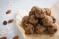 Close-up of homemade dried fruit, nuts and oatmeal balls. Energy balls on a wooden table. Vegetarian, vegan raw dessert. Copy Royalty Free Stock Photo
