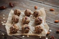 Close-up of homemade dried fruit, nuts and oatmeal balls. Energy balls on a wooden table and ingredients nearby. Vegetarian, vegan Royalty Free Stock Photo