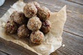 Close-up of homemade dried fruit, nuts and oatmeal balls. Energy balls on a wooden table. Vegetarian, vegan raw dessert Royalty Free Stock Photo