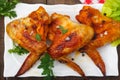 Grilled chicken wings on white plate Royalty Free Stock Photo