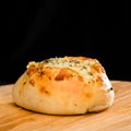 Close-up of homemade mini pizza bun topped with cheese, garlic a Royalty Free Stock Photo