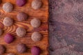 Close Up of Homemade Raw Energy Ball on Rustic Wooden Board on Marble Background Royalty Free Stock Photo