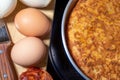 Close-up of homemade Spanish potato omelette with natural ingredients.