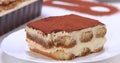 Serving a slice of homemade tiramisu cake