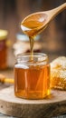 Close-up of honey extraction with beeswax candles and beehive frames in rustic setting Royalty Free Stock Photo