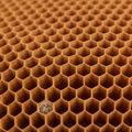 Close-up of a honeycomb structure displaying a repetitive hexagonal pattern. Each Royalty Free Stock Photo