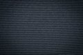 Close-up of Horizontal synthetic black gray leather texture. Surface of rough abstract dark black matte background.