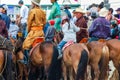 Close up of horseback spectators watching Nadaam h